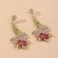Detail von Vintage-Tulpenohrringen mit rosa Strasssteinen und goldener Blumenfassung - Goldene Tulpe