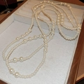Elegant multi-layered long pearl necklace with mixed bead sizes in creamy white tone - White Pearl Long Necklace