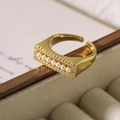Detail of gold-plated adjustable ring with small pearls and clear cubic zirconia stones - Pearl Zircon Rectangular Style (13797)