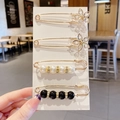 Set of four gold-tone brooches featuring crystal flowers, white pearls, and black beads - Style 11 - No.11 Set 4 Pcs