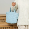 Detailed view of light blue quilted heart handbag with soft stitched texture - 27*10*18.5cm / Azure Blue