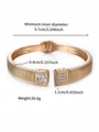 Golden open spring bangle with square and pave cubic zirconia stones and size specs - Crystal White