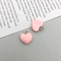 Due graziosi ciondoli in resina rosa a forma di cuore per la creazione di gioielli fai da te - Cuore Opaco Rosa