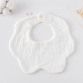 White flower-shaped muslin cotton baby bib with snap button closure on neutral background - Gauze Flower Bandage - White
