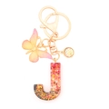 Resin letter J keychain with red glitter, gold flakes, and butterfly charm detail - Letter J