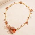 Golden chain necklace featuring brown acrylic flowers and fabric petals in a vintage style - Necklace-Brown Chiffon Flower