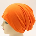 Orange knitted slouchy beanie hat for men and women with soft ribbed fabric texture - Adjustable / Orange