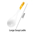 Detail of a 23cm long white ceramic large soup spoon with a yellow hanging handle - 23cm Large Soup Spoon / Gold Yellow