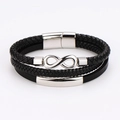 Detalle de una pulsera multicapa de cuero trenzado negro con símbolo de infinito y barra de metal - Color Acero