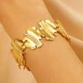 Golden textured leaf bracelet with matte brushed finish shown on a warm satin background - Brushed Leaf Design (4362)