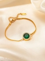 Detail of emerald titanium steel bracelet with white crystal halo on silk background - Round Zirconia Emerald Bracelet