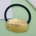 Elastic black hair tie featuring a polished gold oval metal bead with a textured finish - Style 12 (Gold Brushed Oval)