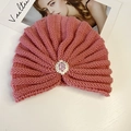 Detail of pink knitted turban hat with vintage metal ornament and purple rhinestones - Rhinestone Style / Pink