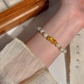 Elegant pearl Pi Xiu bracelet with gold beads worn on wrist with jewelry box - Gold PiXiu Pearl (MY37730)