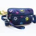 Navy blue nylon crossbody bag with colorful leaf patterns and multi-zipper pockets - Blue with Leaf Patterns