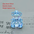 Macro detail of a 29mm blue acrylic bear pendant with faceted gemstone cut and top loop - 29mm*20mm / Lake Blue