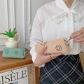 Detail of vintage corduroy makeup bags with embroidered smiles and metal zippers - Khaki Smiley (Small)