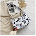 Detail of white baguette bag featuring delicate black butterfly prints and zipper - 23*13*7 / Butterfly