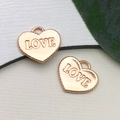 Pair of rose gold heart charms with LOVE engraving and serrated edges for DIY jewelry - Jagged Heart LOVE
