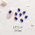 Strass ongle ovale bleu avec bord doré festonné LF7114 dimension 5x7mm - Base Or Pierre Bleu Roi (LF7114) / 5X7mm