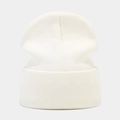 Close-up of cream white ribbed knit beanie featuring detailed texture and wide cuff design - Milky White