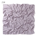 Detail view of the soft solid color imitation silk square scarf in elegant light purple. - Pale Purple