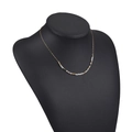 Bohemian gold chain necklace with layered white beads and metallic spacers on neck model - White Grey Beads with Gold Spacers