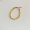 Gold-plated stainless steel snake chain bracelet with adjustable clasp and logo tag - Gold Snake Chain (SBK603)