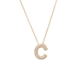Detail of gold letter C pendant with micro-pave white zircon inlay on thin necklace - Letter C
