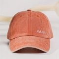 Detail view of the white mama embroidery on a vintage brick red washed baseball cap - One Size / Washed Orange