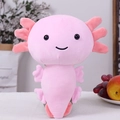 Cute pink plush axolotl toy with signature gills and soft finish sitting on a home desk - 20cm / Pink