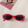 Y2K style bright pink oval sunglasses with hollowed-out frames and grey lenses - Oval Hollow Frame / Lotus Red