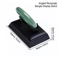Black leather jewelry display stand with inclined surface for showcasing green bangles - Beveled Rectangular Bracelet Holder (Black)