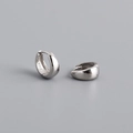 Close-up of S925 sterling silver huggie earrings with high-polished mirror finish - Inner 7mm / White Gold