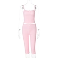 Detailed close-up of pink ribbed knit fabric texture on camisole and leggings set - Pink