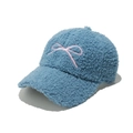 Detailed shot of blue teddy fleece baseball cap with pink embroidered bow decoration - M (56-58cm) / Blue
