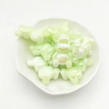 Iridescent light green bear-shaped gradient resin beads in shell ceramic dish - Green
