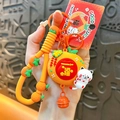 Cute lucky cat keychain featuring a vibrant orange charm and bell for good fortune - Money Bag Rotating Style