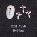 Macro shot of silver gothic bat wing cross nail charm with a red rhinestone inlay - Silver Bat Wing Cross with Red Stone (A256)