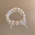 Detail of crystal butterfly beaded bracelet with yellow citrine beads and rose pendant - Silver-White-Yellow-Butterfly