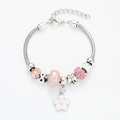 Silver snake chain bracelet with pink flower charms and crystal beads on white background - Pink Floral Bracelet