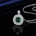Polished silver pendant necklace featuring a cushion-cut green stone with double halo - Tz-23