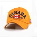 Orange cotton baseball cap featuring CANADA embroidery and maple leaf design on front - M / Orange