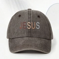 Close-up of washed cotton texture and JESUS slogan printing on the baseball cap - Coffee