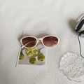 Retro oval sunglasses with beige frames and gradient brown lenses on artistic background - Cream Light Tea