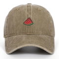 Close-up of vintage washed khaki baseball cap with detailed red watermelon slice embroidery - One Size / Khaki