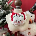 Close-up of reindeer plush bib for pets with red and white knit festive textures - One Size / Bear With Antlers