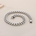Macro shot of a 13mm silver stainless steel Cuban link necklace with secure clasp - 21cm / 13mm Steel Color
