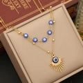 Gold double-layered necklace featuring blue evil eye charms and a sunburst pendant - Double Layer Evil Eye Necklace (1#Necklace)