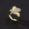 Close-up of heart-shaped gold ring with cubic zirconia stones and adjustable band - Style 9